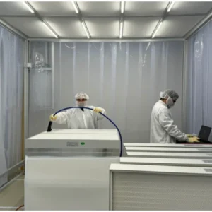 Cleanroom technicians testing large air filtration units